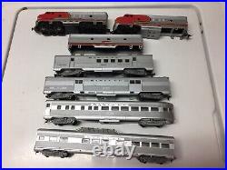 Sante fe 4 car passenger set with a-b(shell)-a dummy(missing 1 truck) ho scale