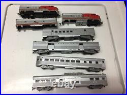 Sante fe 4 car passenger set with a-b(shell)-a dummy(missing 1 truck) ho scale